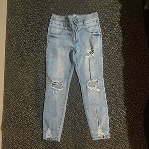 High wasted refuge size 12 distressed light washed jeans with holes